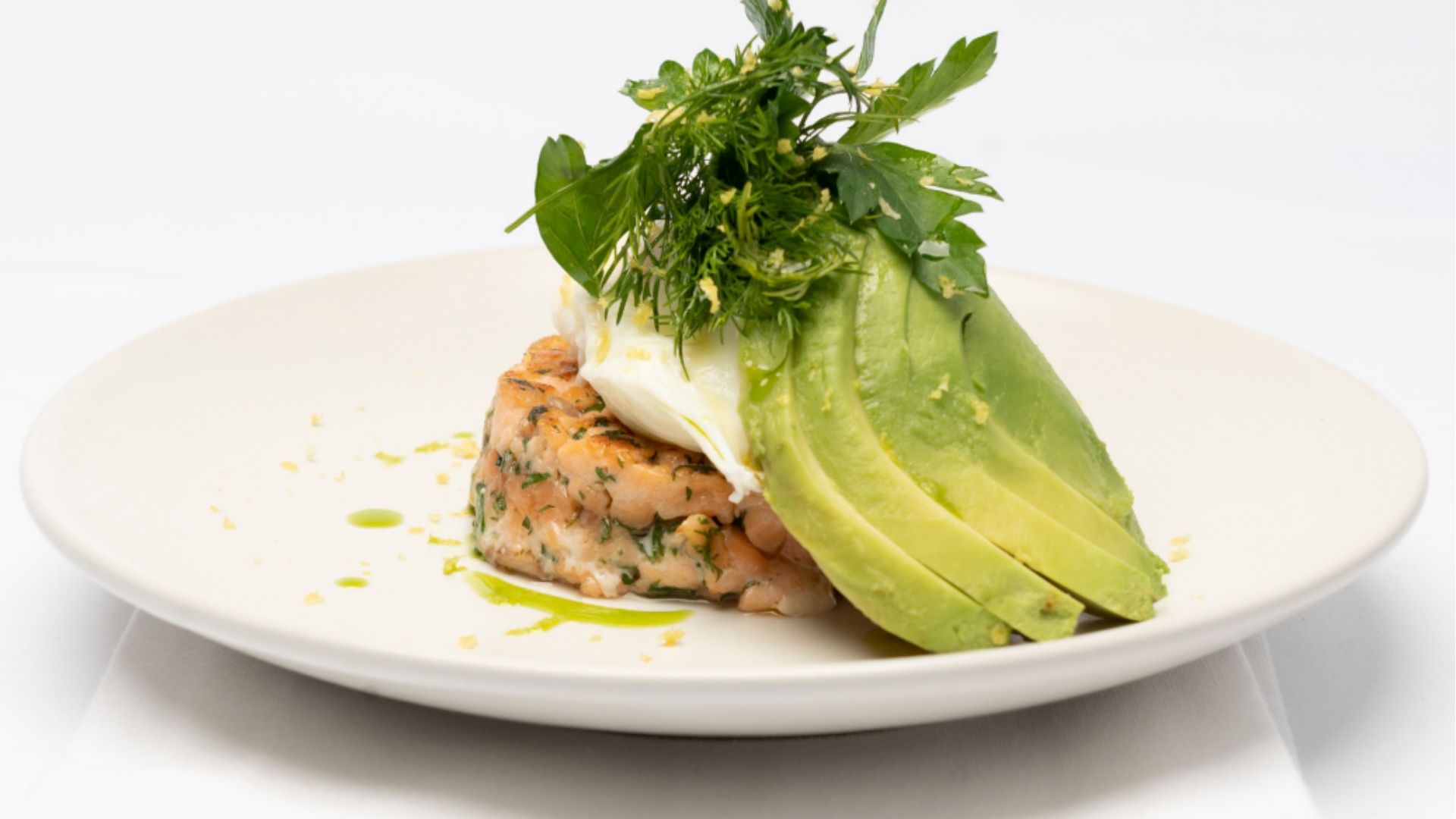 Herb-Infused Salmon Cakes with Avocado and Poached Egg